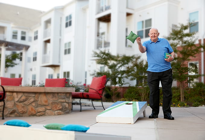 Brightview Senior Living Resident Playing Cornhole
